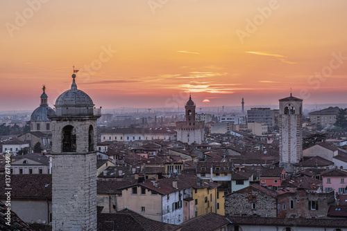 Sunset view over the rooftops of the old town of Brescia, Italy.