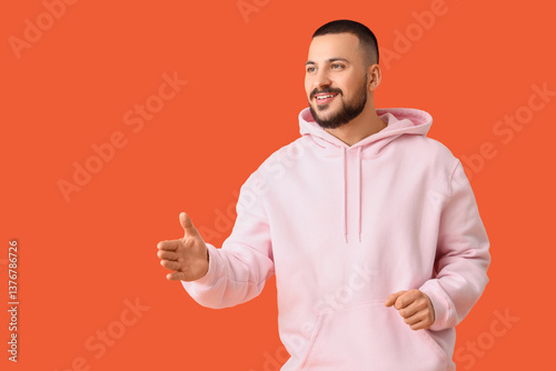 Young man reaching out for ...