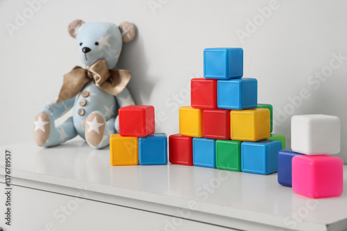 Colorful cubes with toy bea...