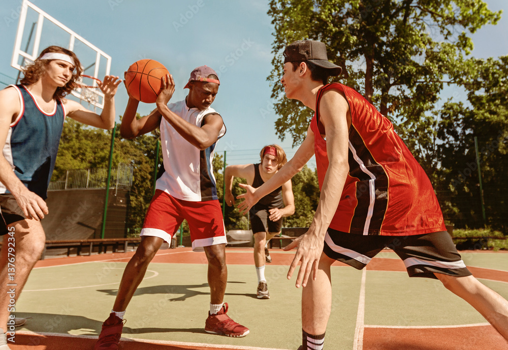 Fototapeta premium Diverse basketball team training for big match at ourdoor sportsground