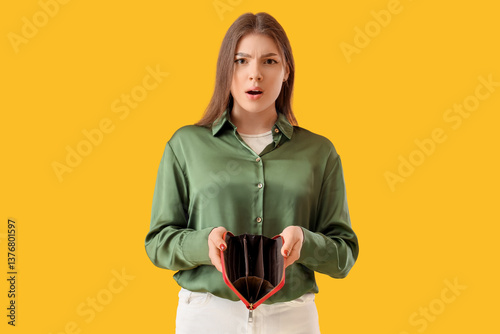Shocked young woman with em...