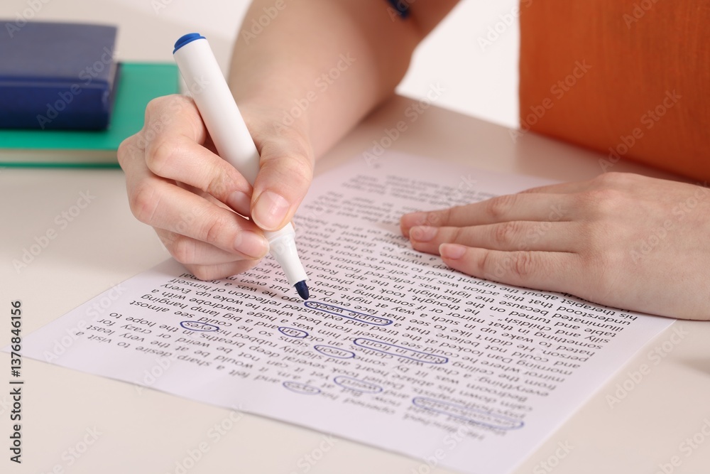 Obraz premium Woman circling important information with marker at white desk indoors, closeup