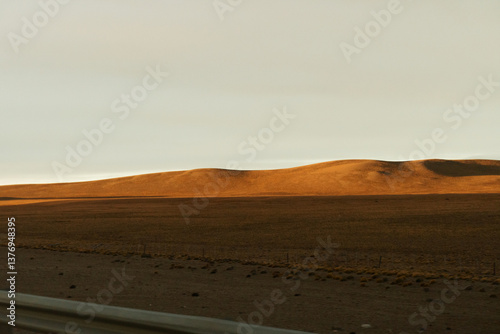 Golden Hills Under A Calm Sky