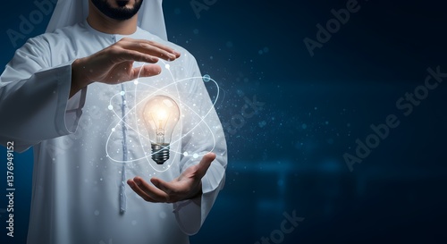 Arab Man Holding Glowing Light Bulb with Atom Graphic for Innovation