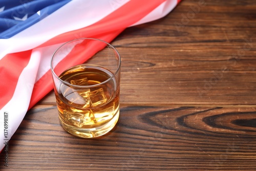 Obraz na płótnie Glass of whiskey and American flag on wooden table. Space for text w salonie