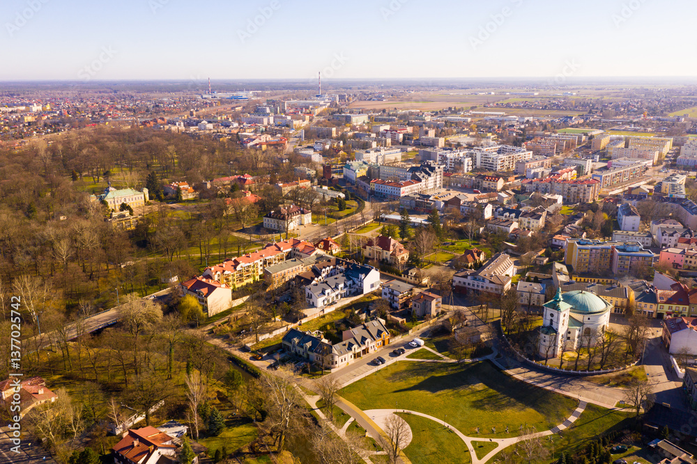 Fototapeta premium Aerial view of modern landscape of Polish town of Skierniewice on spring day, Lodz Voivodeship