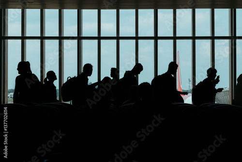 Anonymous group of traveler waiting in a line for flight  photo