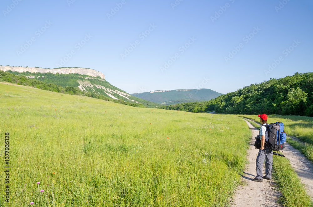 Obraz premium Man tourist in mountains..