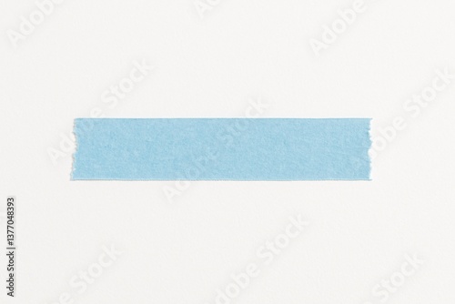 Single strip of light blue washi tape with torn edges on white background