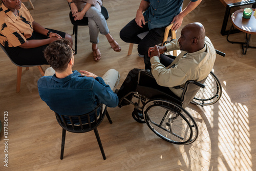 Diverse people discussing in group therapy session
