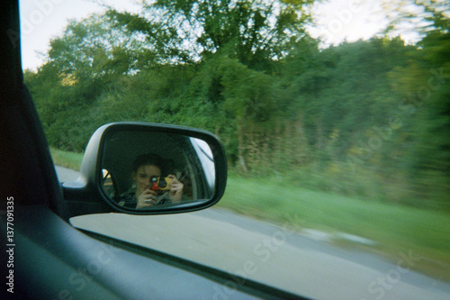 Film Travel Portrait in Reflection of Car Mirror