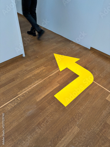 yellow arrow on floor