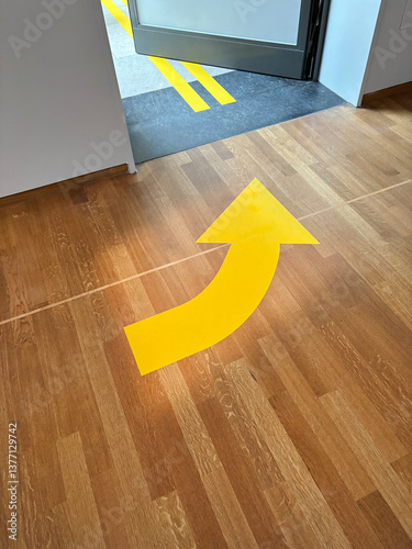 yellow arrow on floor