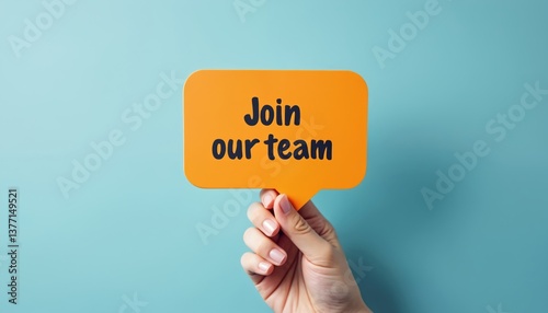 Hand holding yellow speech bubble with text Join team against blue background. Recruitment hiring employment concept. Seeking job position work offers. Human resources, career opportunity, job search.