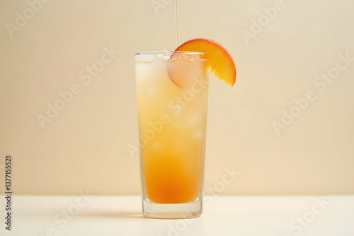 Refreshing peach cocktail presentation in a frosted glass with ice, showcasing vibrant colors and a fresh peach slice, ideal for summer promotions and beverage advertising