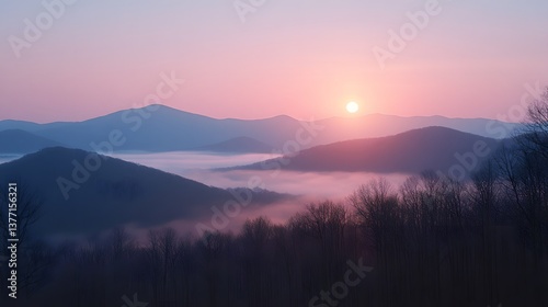 Enchanting sunset casting an orange glow over the mountain range while the sky transitions into vibrant evening hues