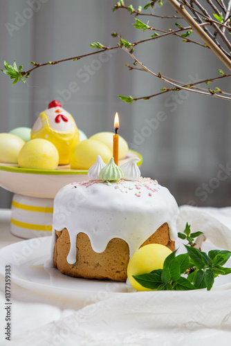 Easter. On the festive table there is Easter cake and painted eggs.