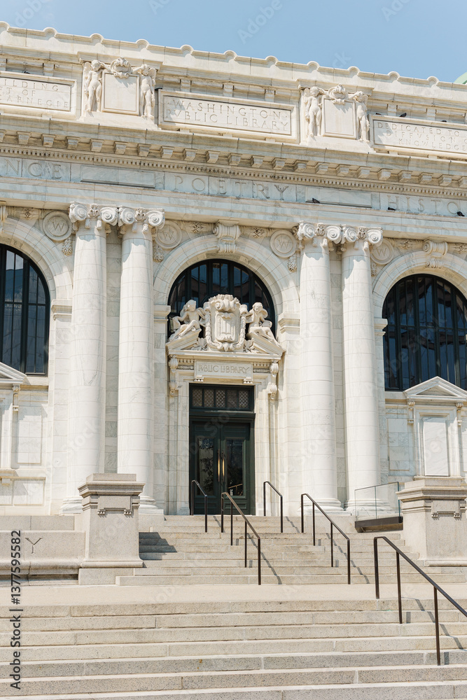 Fototapeta premium Public library entrance with marble columns and carved details.