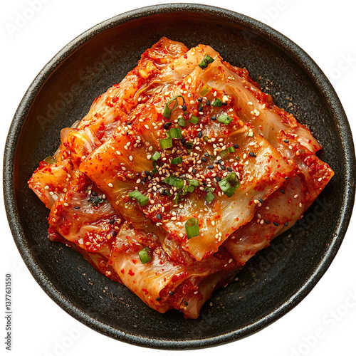Top view of a delicious looking kimchi on a dark stoneware plate isolated on a white transparent background