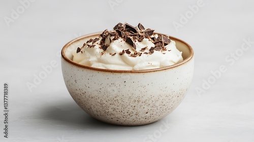 Classic topped with cocoa in a ceramic dish light gray background