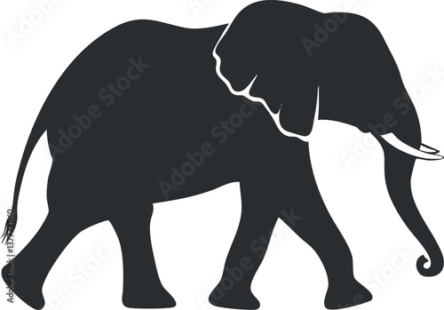 Silhouette of an elephant walking, showcasing its large ears and trunk in profile view.