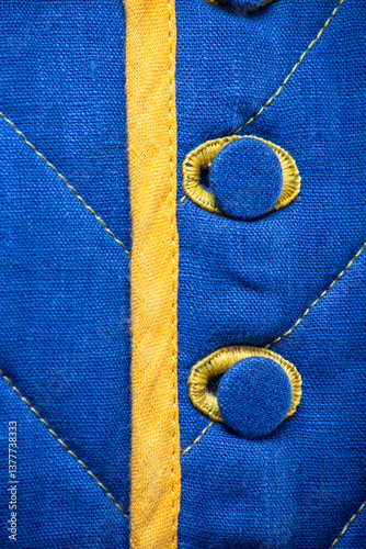 Detailed View of Blue Quilted Textile with Yellow Accents. 