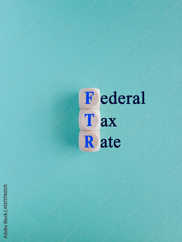 Federal tax rates symbol. Concept words Federal tax rates on wooden cubes. Beautiful blue background. Business concept.