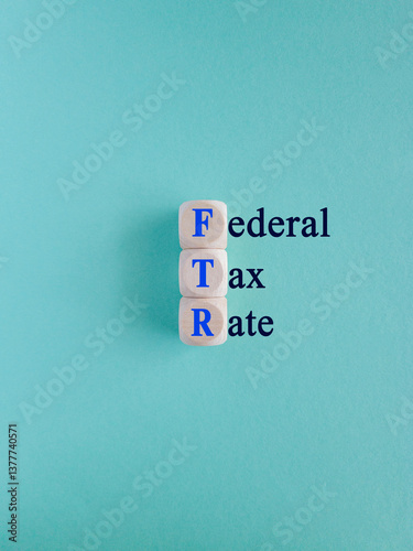 Obraz na płótnie Federal tax rates symbol. Concept words Federal tax rates on wooden cubes. Beautiful blue background. Business concept. w salonie