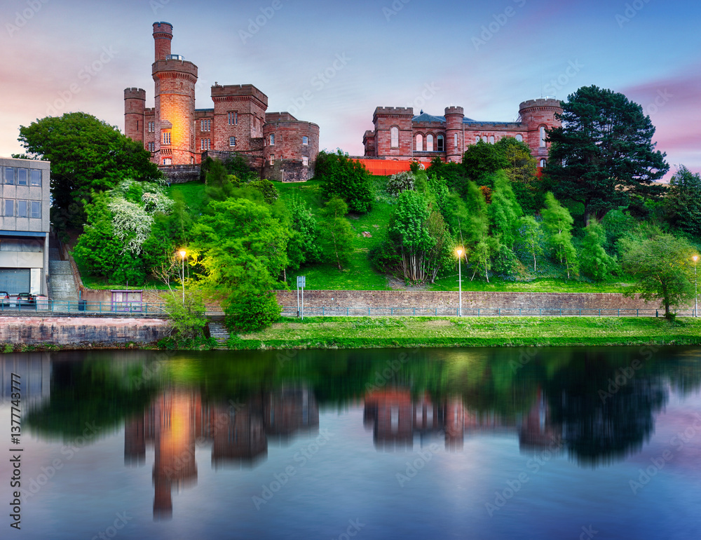 Scotland - Inverness skyline with castle reflection in Ness river at dramatic sunset, UK Scotland - Inverness skyline with castle reflection in Ness river at dramatic sunset, UK
