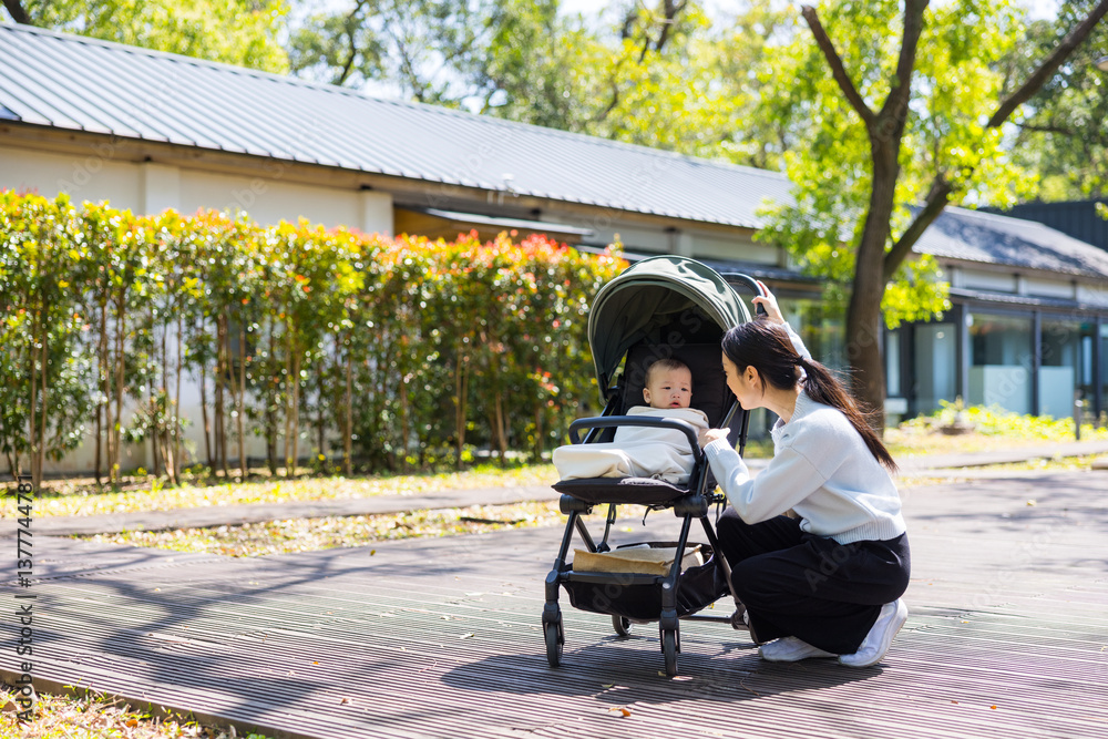 Mum with her baby son at outdoor park