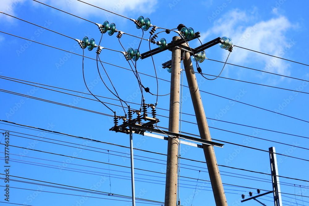 A utility pole with multiple green lights at the top, suitable for use in illustrations or designs related to energy, technology, or urban settings.