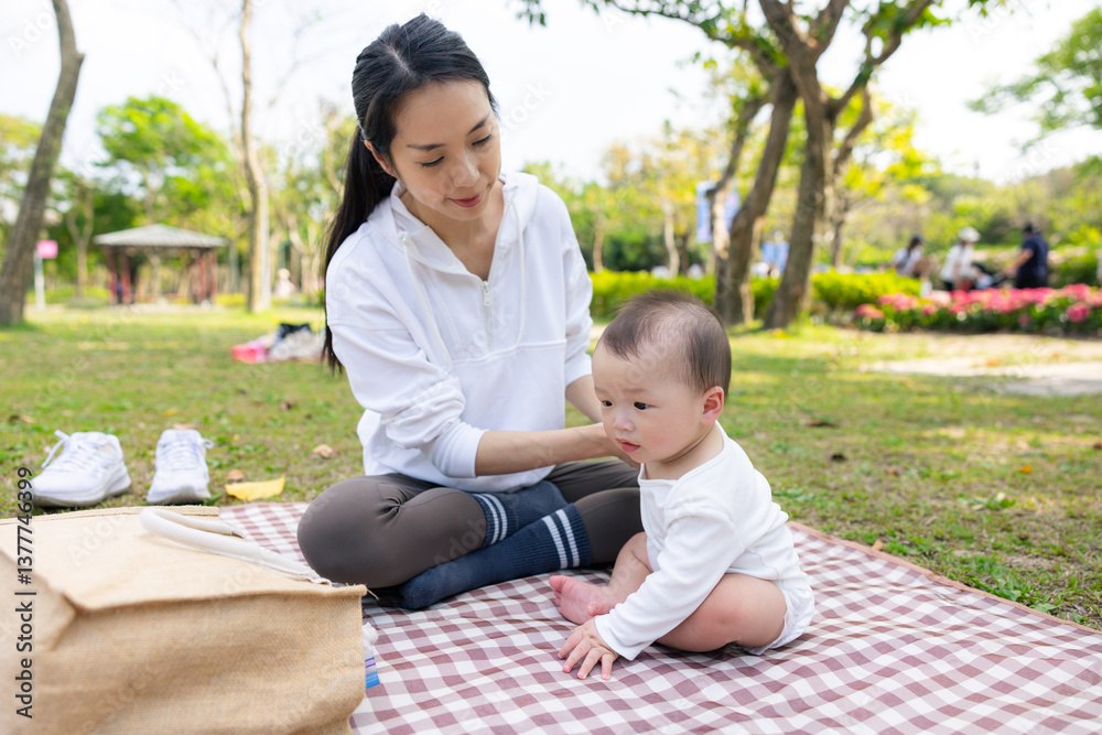 Mother going on picnic with baby at park