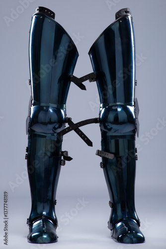 Shiny Steel Medieval Leg Armor. Full leg protection with straps and buckles detail.