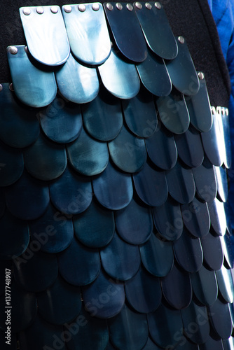 Close-up of Byzantine Lamellar Armor Scales. Detailed view of overlapping metal plates on medieval scale armor.
