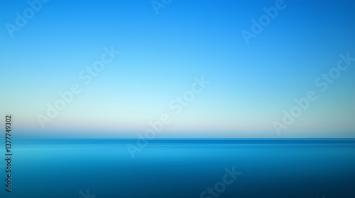 Minimalist seascape with smooth blue gradient sky at dusk