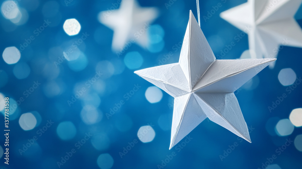 Obraz premium White paper stars hanging against blue night sky