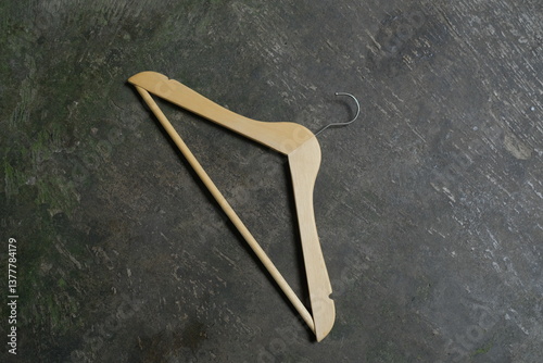 Photo of a wooden clothes hanger on the floor
