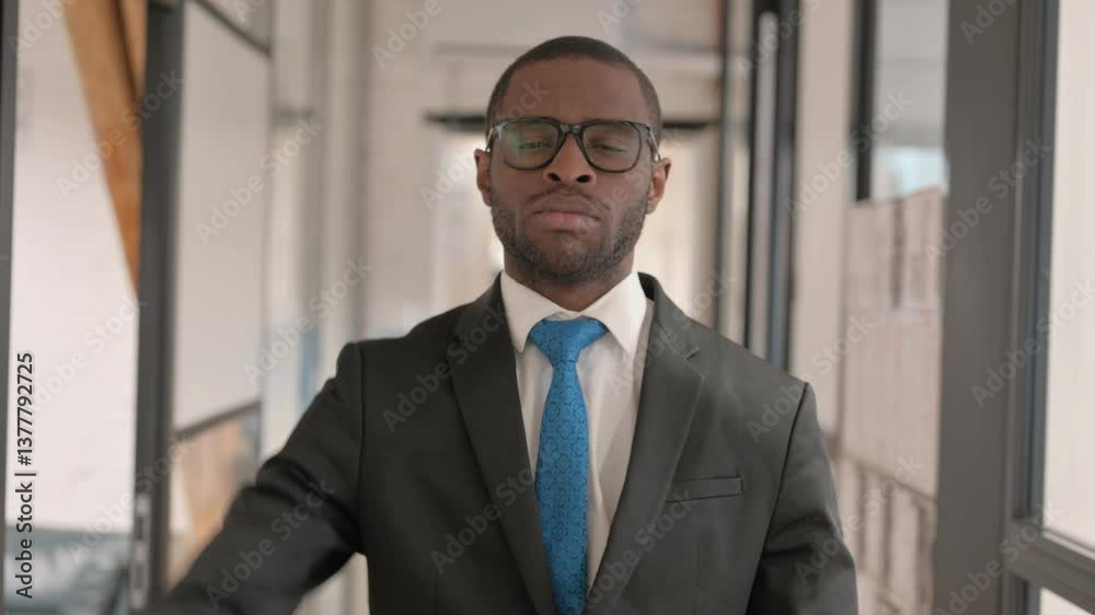 Portrait of African Businessman with Thumbs Down Looking at Camera Portrait of African Businessman with Thumbs Down Looking at Camera