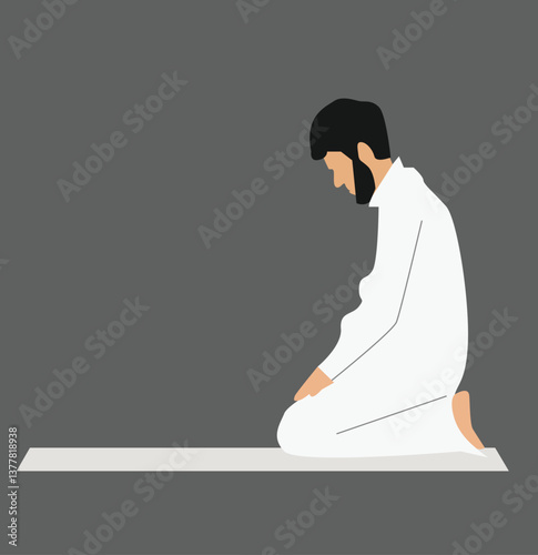 Muslim man praying on a prayer matte.
