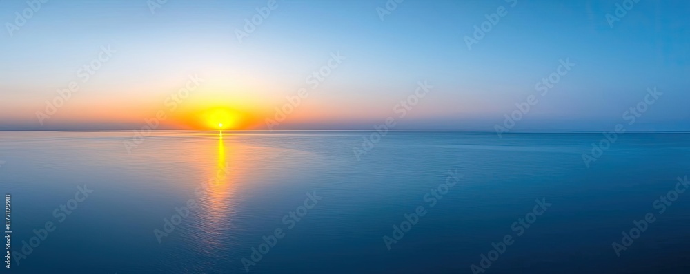 Obraz premium Sunset over the ocean scenic view with vibrant sky and dramatic dusk concept. Stunning sunset over calm water with vibrant colors reflecting.