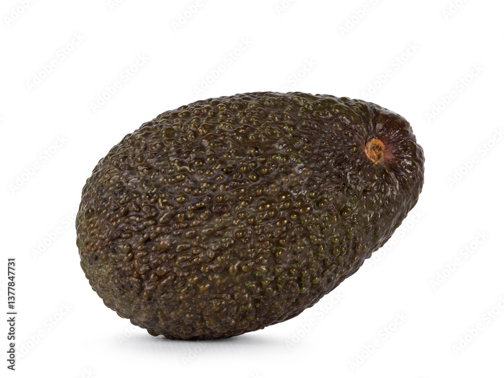 Avocado laying side ways. Isolated on a white background Avocado laying side ways. Isolated on a white background
