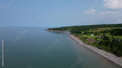 Wallpaper Mural Dramatic Coastal Erosion: Rocky Shoreline and Trees Crumbling into the Seav Torontodigital.ca