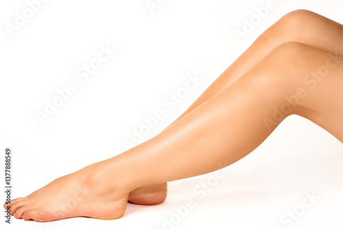 Woman's smooth legs and feet showcasing soft and well-maintained skin.