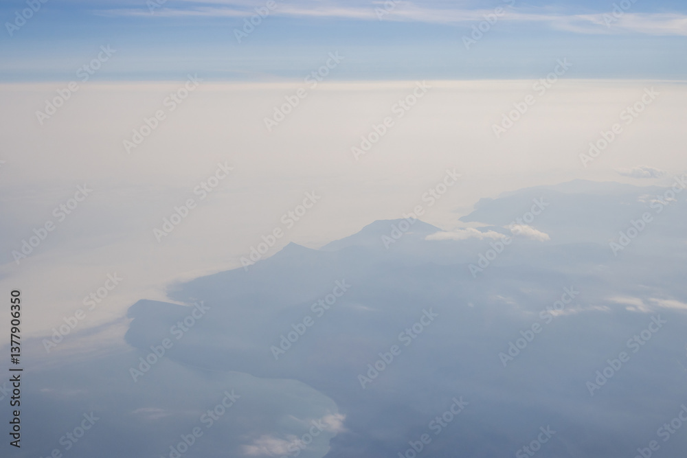 Aerial view of the sea coast. Coast of the Sea of Okhotsk, Magadan region, Far East of Russia. Soft focus. Blurred natural background.