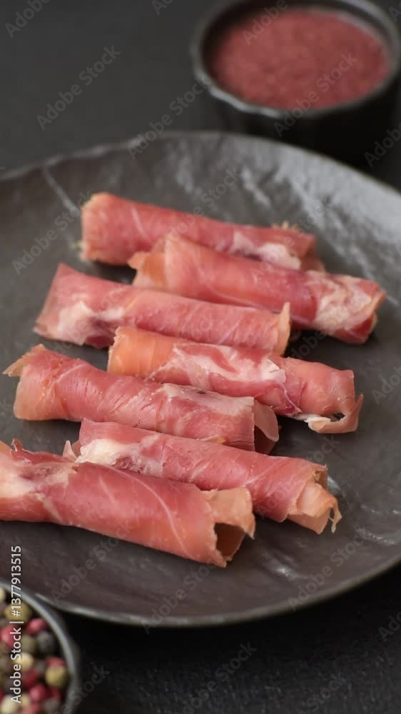 Cheese and meat, jamon or prosciutto rolled into a roll. Antipasti or delicacies for the festive table Cheese and meat, jamon or prosciutto rolled into a roll. Antipasti or delicacies for the festive table