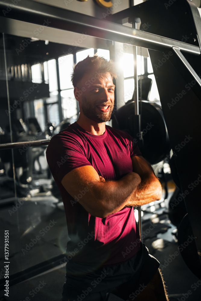 Confident Young Man Posing in the Gym During a Workout Session Confident Young Man Posing in the Gym During a Workout Session