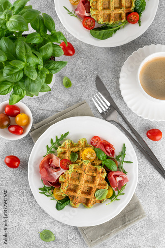 Obraz na płótnie Spinach waffles with tomatoes, arugula and prosciutto on a white plate with a cup of coffee. Healthy breakfast. Top view w salonie