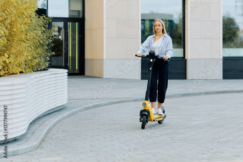 Photos Free mobility concept, young woman using electric scooter as a means of transpor