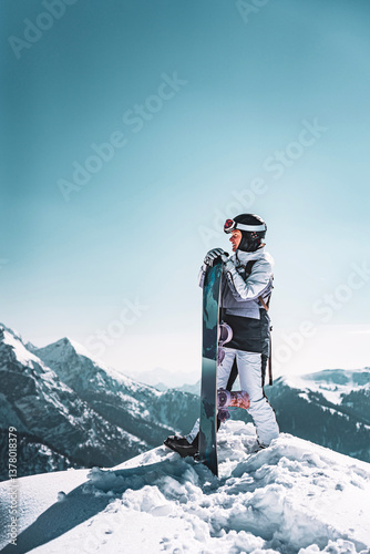 Photo of woman with snowboard on top of the Spinale Hill