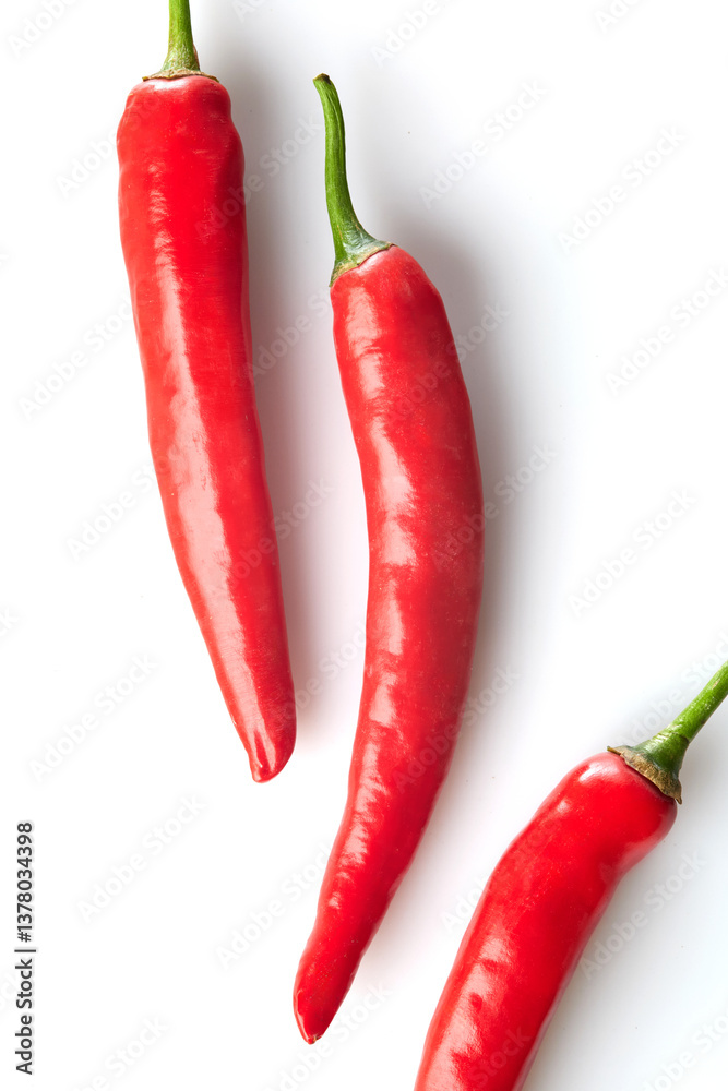 Close up of Red Chili Peppers Showcasing Texture and Vibrant Colors on White and Isolated Background Close up of Red Chili Peppers Showcasing Texture and Vibrant Colors on White and Isolated Background